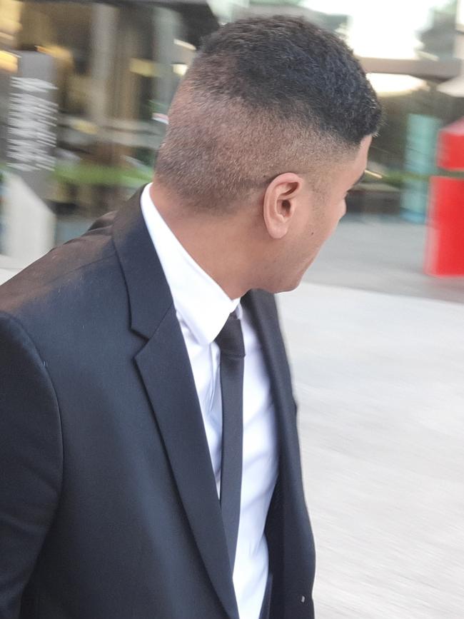 Queanbeyan rugby union player Ropati Dominic 'Dom' Finau looks away from cameras as he leaves the ACT Supreme Court earlier this year. Picture: Craig Dunlop