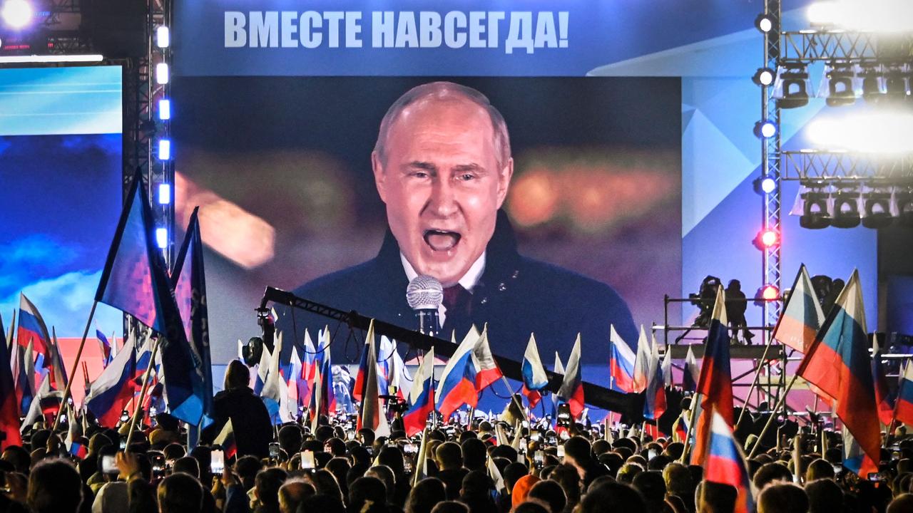 Vladimir Putin is seen on a screen set in Red Square. Picture: Alexander Nemenov/AFP