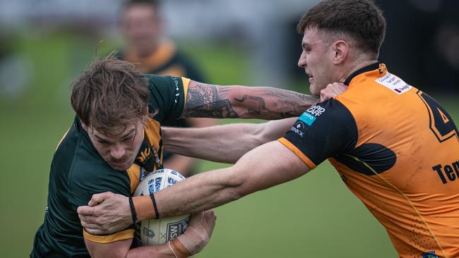 Dylan Clark trying to evade The Entrance’s Max Trueman. Picture: Julian Andrews