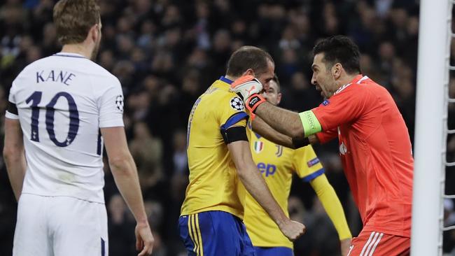 Juventus goalkeeper Gianluigi Buffon congratulates his teammate Giorgio Chiellini