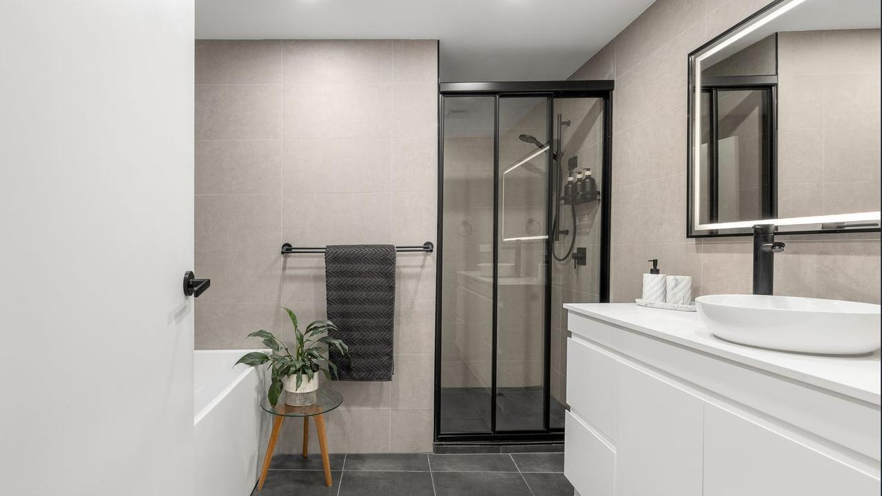The apartment has two bathrooms and a separate powder room.