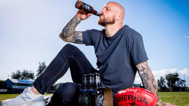 Melbourne captain Nathan Jones tries Carlton Zero when it was launched last year. Picture: Jake Nowakowski