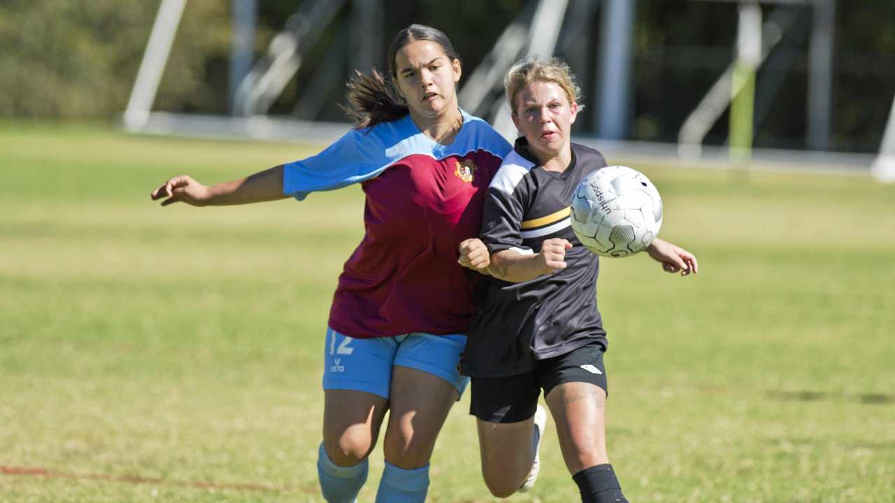 TIGHT TUSSLE: St Albans player Savannah Orcher (left) battles for possession with West Wanderers Rebecca Davis. St Albans easily accounted for Wanderers winning the game 10-0. Picture: Nev Madsen