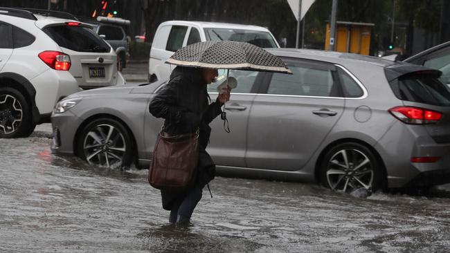 Roads in Southbank are flooding as wet weather sets in across Melbourne and much of Victoria. Picture: NCA NewsWire/ David Crosling