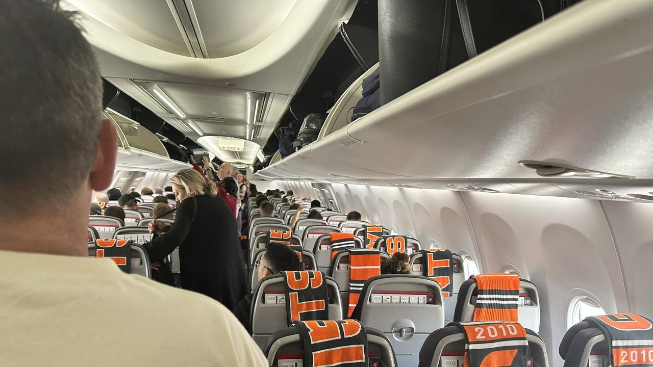 GWS leave scarves for passengers on a special Virgin flight from Sydney to Melbourne. Photo: Lachlan McKirdy, Twitter