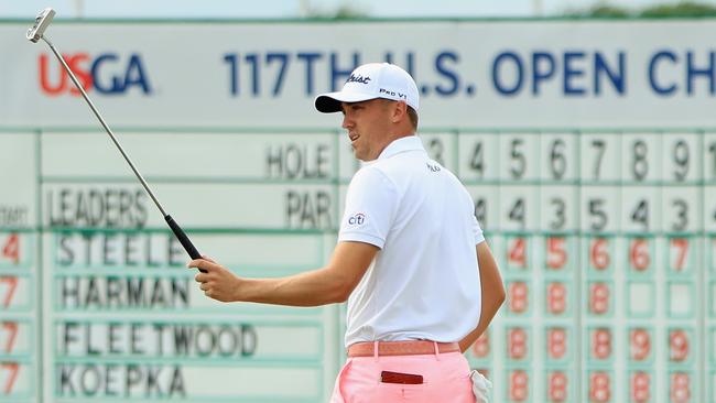 Justin Thomas of the United States reacts after making an eagle on the 18th hole.