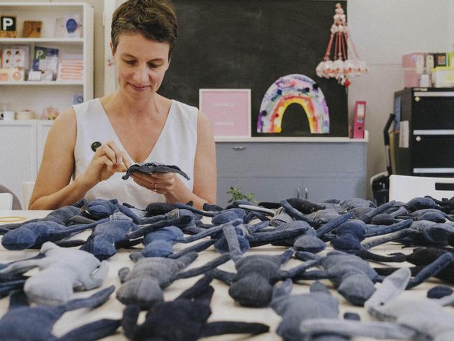 Artist Belinda Smith, of Blue Jean Sisters, with some of the denim dolls to be part of an exhibition to raise awareness of human trafficking and sexual exploitation. Pic: Briony Walker.