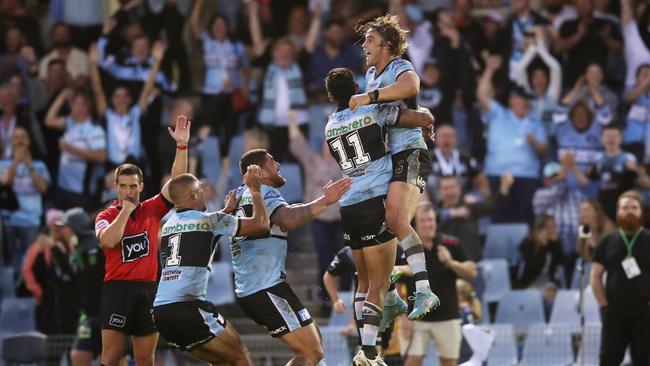 SYDNEY, AUSTRALIA - MARCH 19: Nicholas Hynes of the Sharks celebrates with teammates after kicking a conversion to win the match after the final siren during the round two NRL match between the Cronulla Sharks and the Parramatta Eels at PointsBet Stadium, on March 19, 2022, in Sydney, Australia. (Photo by Matt King/Getty Images)