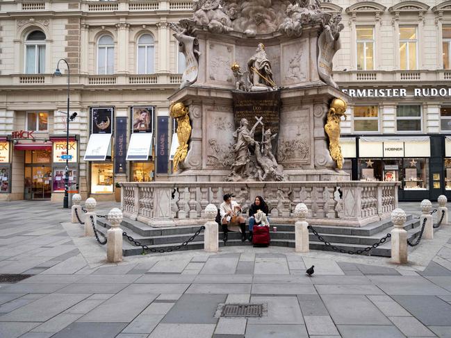 The Plague Column in Vienna is normally packed with crowds as Austria entered a lockdown in a desperate effort to contain spiralling coronavirus infections. Picture: AFP