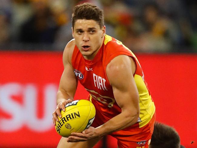 MELBOURNE, AUSTRALIA - JUNE 12: Dion Prestia of the Suns and Trent Cotchin of the Tigers in action during the 2016 AFL Round 12 match between the Richmond Tigers and the Gold Coast Suns at the Melbourne Cricket Ground on June 12, 2016 in Melbourne, Australia. (Photo by Michael Willson/AFL Media/Getty Images)
