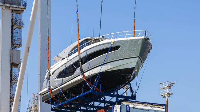 A Riviera 6800 being loaded onto the ship bound for Florida