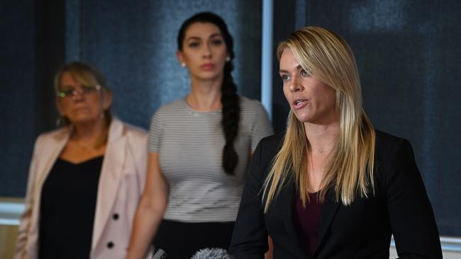 Crimial lawyer Kristy Bell, right, watched by Vicki and Shannah Blackburn as they discuss forensic revelations in regards to the 2013 murder of Shandee. Picture: Lyndon Mechielsen/The Australian