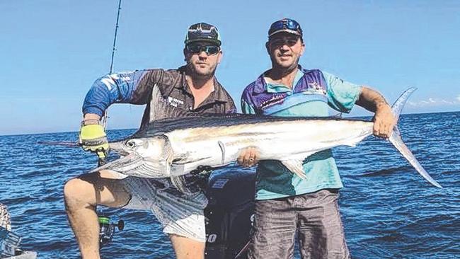 Doug Saunders (left) and Clint Jebbink with a beaut black marlin from the phenomenal fishery.