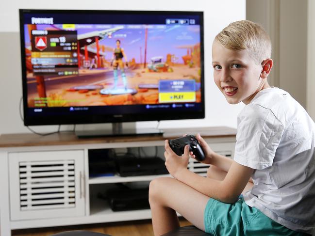 Cooper Thompson’s mum Jacinta Phillips lets him play Fortnite at certain times of the day but only when his homework is finished. Picture: AAP/Josh Woning