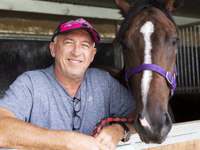 Trainer Rob Heathcote and Rothfire posing at Eagle Farm Racecourse, 230 Lancaster Rd, Ascot, Brisbane, 27th of February 2020. (AAP Image/Attila Csaszar)