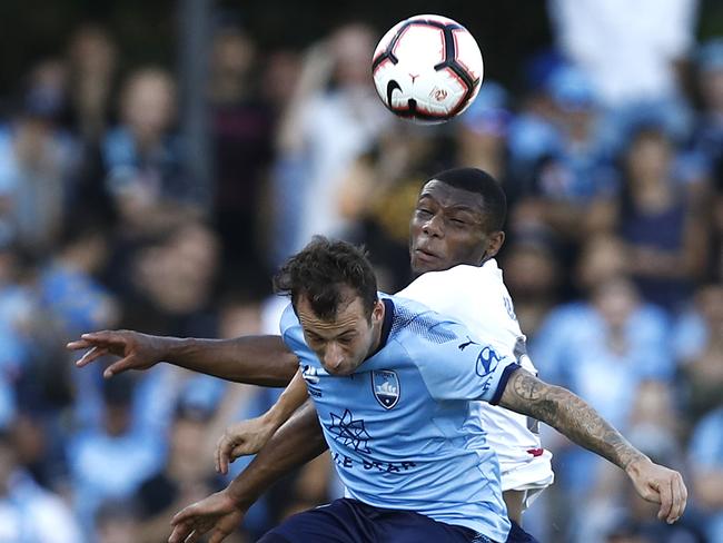 Adam le Fondre of Sydney FC competes for the ball against Sam Graham of the Mariners. Picture: Ryan Pierse/Getty Images
