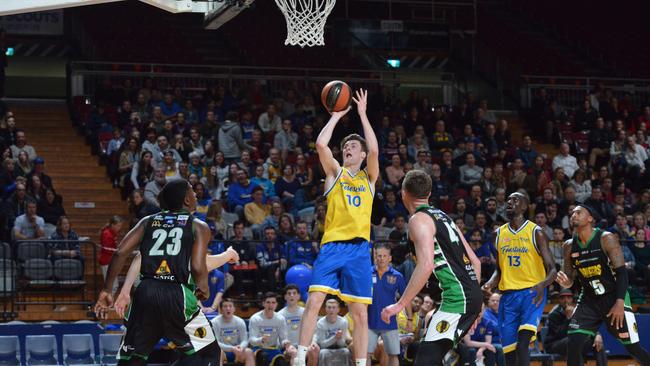 Forestville’s Michael Harris prepares to shoot for goal during the men’s Premier League basketball grand final against Mount Gambier at Basketball SA Stadium on Saturday night. Harris claimed the MVP award after the Eagles’ 17-point title win. Picture: AAP/Brenton Edwards