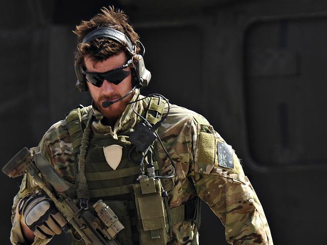 SAS Corporal Ben Roberts-Smith VC, MG, with the Australian Special Operations Task Group, leaves a UH-60 Blackhawk helicopter during preparation of the Shah Wali Kot offensive in Afghanistan, 06/2010. Roberts-Smith was later awarded the Victoria Cross during action in saving the lives of wounded comrades.