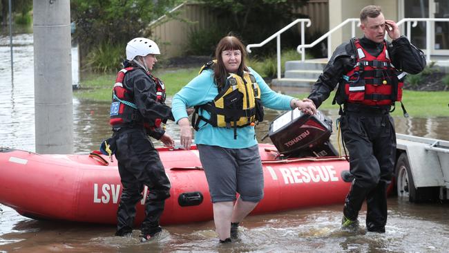 Water police rescue a woman from her Shepparton home. Picture: David Crosling