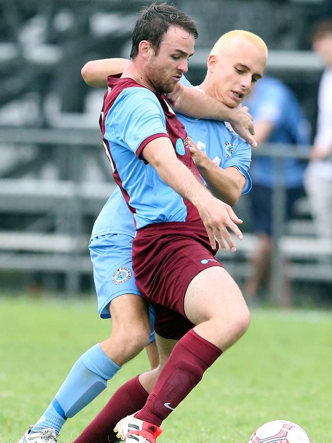 Coomera’s Michael Townsend and Palm Beach’s Marley Arreola do battle. Picture: Richard Gosling