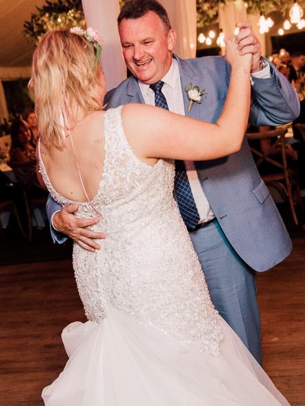 Mr Mitchell dancing with his daughter Morgan on her wedding day. Picture: Supplied