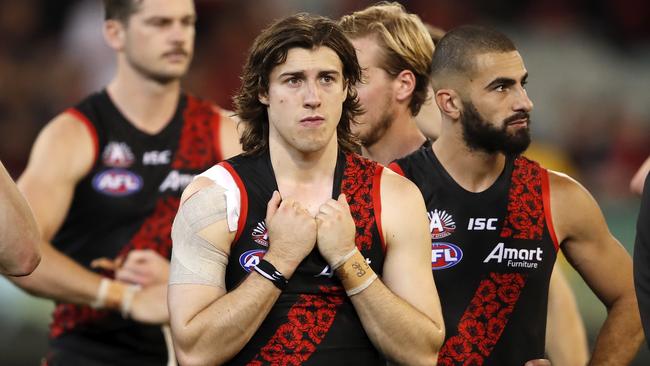 Andrew McGrath (front) will be a key cog in Essendon’s resurgence, as players like Adam Saad (back right) leave the club. Picture: Dylan Burns/AFL Photos