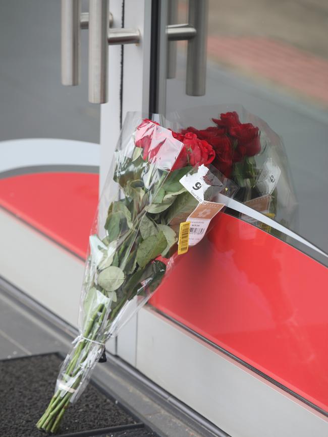 Flowers have been left at the scene of the alleged stabbing murder. Picture: Dean Martin