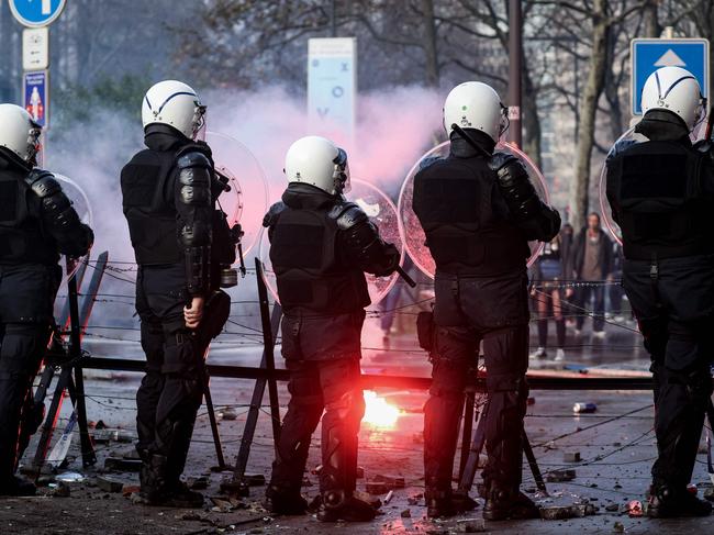 Belgian riot police stand in position as clashes erupt during a demonstration. Picture: AFP