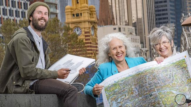 Lewis Brownlie, Melinda Clarke and Deborah Young have helped reboot Melbourne’s famous illustrative map, spending more than 40,000 hours researching the new and improved version 27 years after the first. Picture: Jason Edwards