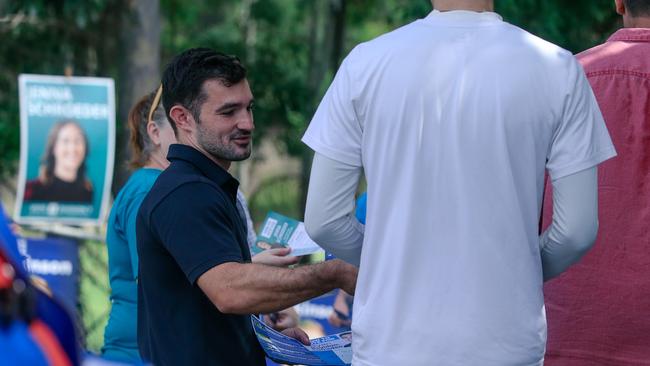 Murder-accused councillor Ryan Bayldon-Lumsden handing out how to vote material at Arundel State School. Picture: Glenn Campbell