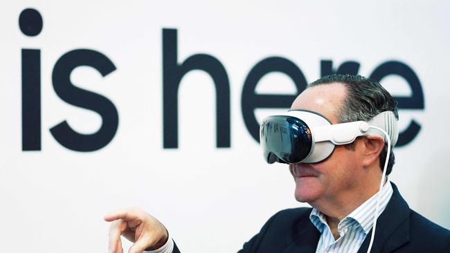 A man uses Apple’s Vision Pro mixed reality glasses at the Mobile World Congress, the telecom industry's biggest annual gathering.