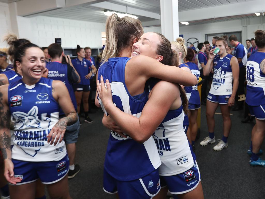 Tasmanian North Melbourne player Nicole Bresnehan, right, celebrates winning the team’s first match with team mate Kaitlyn Ashmore. Picture: LUKE BOWDEN