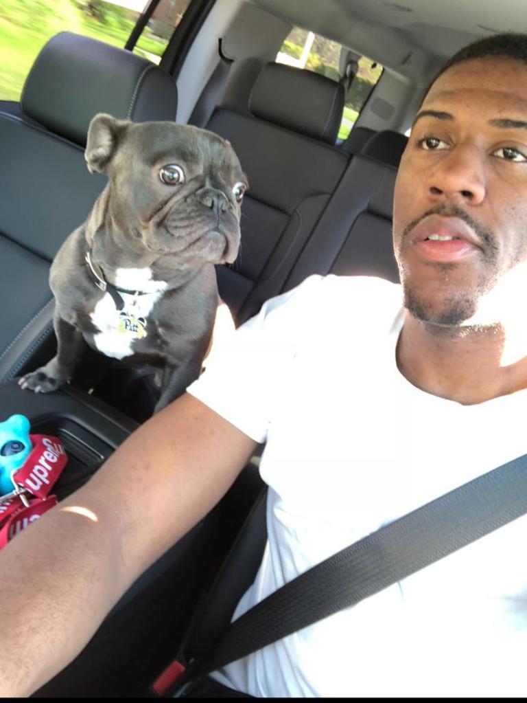 Basketball star Lamar Patterson and his pet dog Kobe.