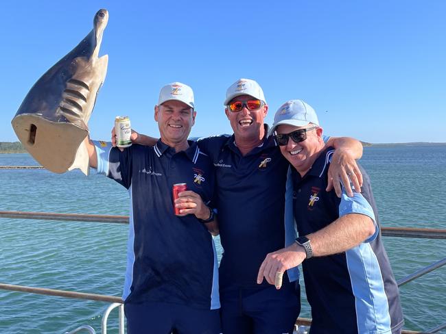 Mornington Peninsula players Andrew Shannon, Chris Lanting and Brendon Gardner with the Hammerhead (the trophy for man-of-the-match) on the ferry back from French Island. Picture: Supplied