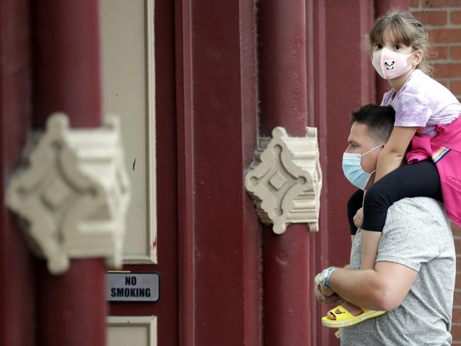 Health experts are divided over whether masks are necessary in the fight against COVID-19. Picture: AP Photo/Mark Humphrey