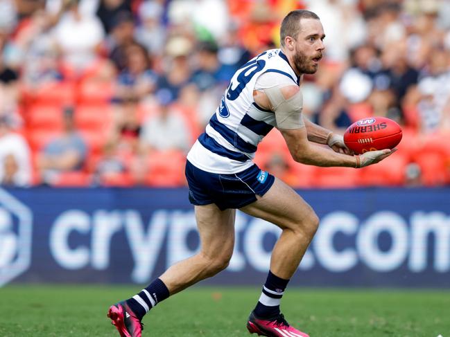 Cam Guthrie fires a handball. Picture: Russell Freeman/AFL Photos via Getty Images