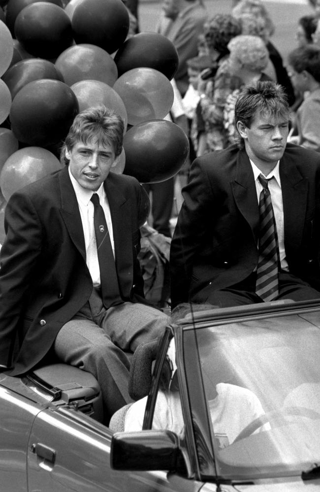 Essendon's Mark Thompson and Mark Harvey during the 1990 Grand Final parade.