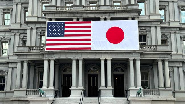 US and Japanese flags are seen posted on the Eisenhower Executive Office Building next to the White House ahead of a visit from Japanese Prime Minister Fumio Kishida.