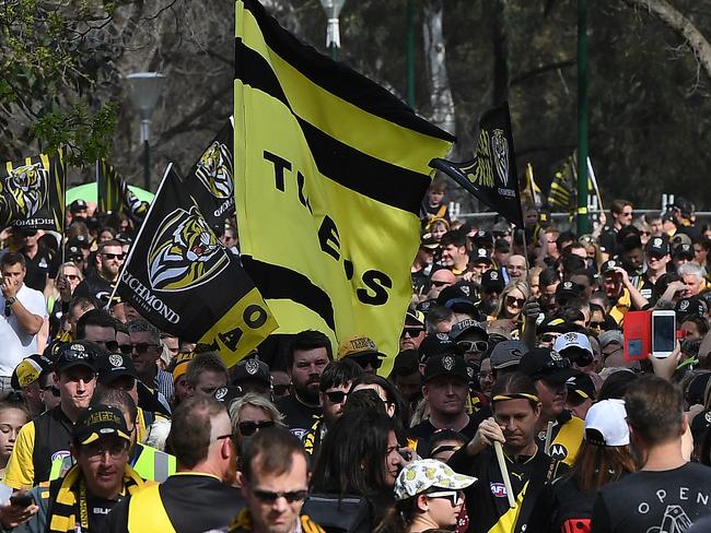 Tigers fans arrive for the second AFL preliminary final between the Richmond Tigers and the GWS Giants at MCG in Melbourne. Picture: AAP Image/Julian Smith