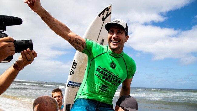 Joel Parkinson of Australia is chaired up the beach after winning the Hawaiian Pro at Haleiwa, Oahu, Hawaii, USA.