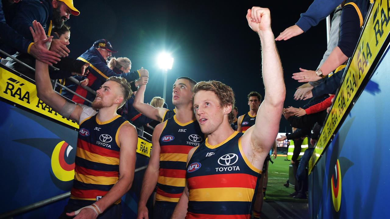 ADELAIDE, AUSTRALIA - JUNE 30:  Rory Sloane of the Crows celebrates with fans after the round 15 AFL match between the Adelaide Crows and the West Coast Eagles at Adelaide Oval on June 30, 2018 in Adelaide, Australia.  (Photo by Daniel Kalisz/Getty Images)