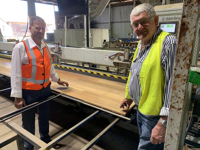 (L) DTM Timber General Manager Ian Haines and Chairman DW "Curly" Tatnell at the end of the laminated timber production line. Photo: Stuart Fast