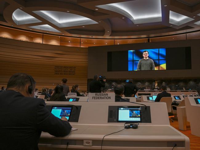 Ukraine's Foreign Minister Dmytro Kuleba is seen on a TV screen while addressing with a pre-recorded video message the Conference on Disarmament in Geneva. Picture: AFP