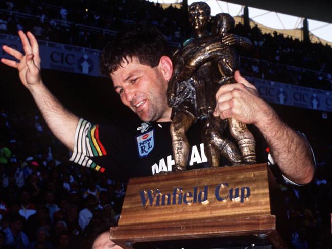 Royce Simmons celebrates with Winfield Cup after Penrith's win over Canberra in grand final at Sydney Football Stadium, 23/09/91. Pic Ex Brisbane Sun.