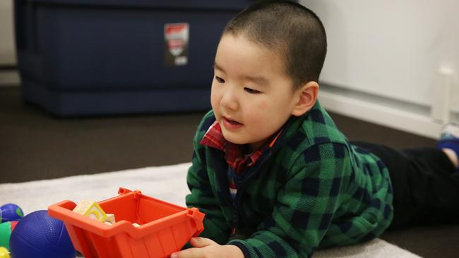 Charles Shao plays with trucks and blocks during his assessment at the Brain and Mind Centre in Camperdown. Picture: Toby Zerna