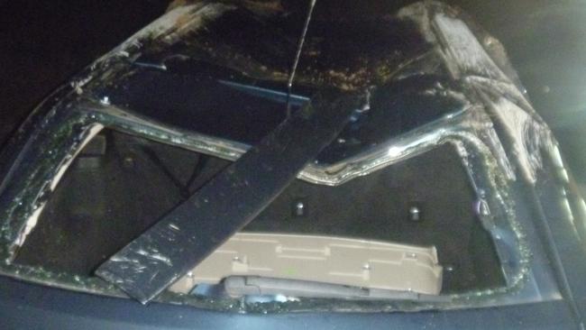 The damage to the car’s roof after it flipped.