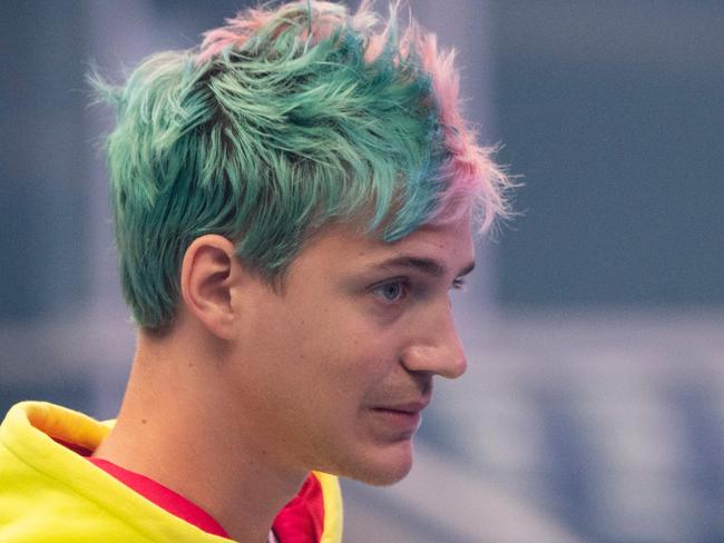 Richard Tyler Blevins, aka Ninja, speaks to the crowd at the start of the 2019 Fortnite World Cup Finals - Round Two on July 27, 2019, at Arthur Ashe Stadium, in New York City. - On August 1, 2019 Ninja announced he was leaving Twitch to take his video-game livestreams exclusively on Microsoft’s streaming service: Mixer. (Photo by Johannes EISELE / AFP)