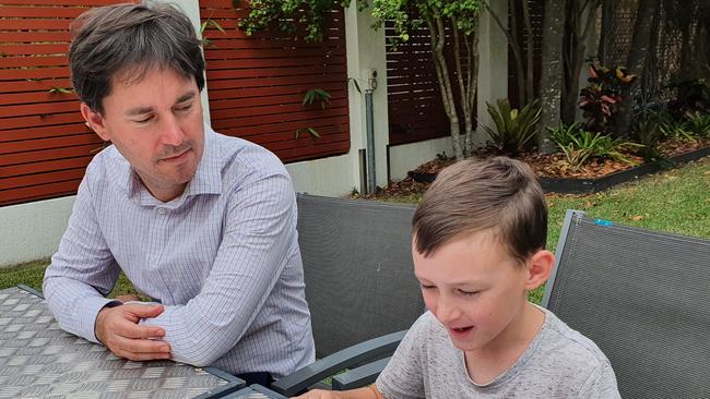 Fraser Coast Mayor George Seymour listens intently to Coen Katt, 8, reading his winning story â&#128;&#152;The Little Antâ&#128;&#153;.