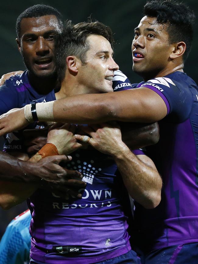 Richie Kennar (right) celebrates a Cooper Cronk try.