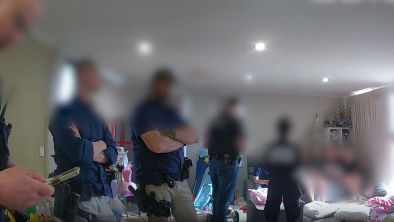 Image from a police raid on a Southport property in relation to an alleged SIM card scam. Picture: QPS